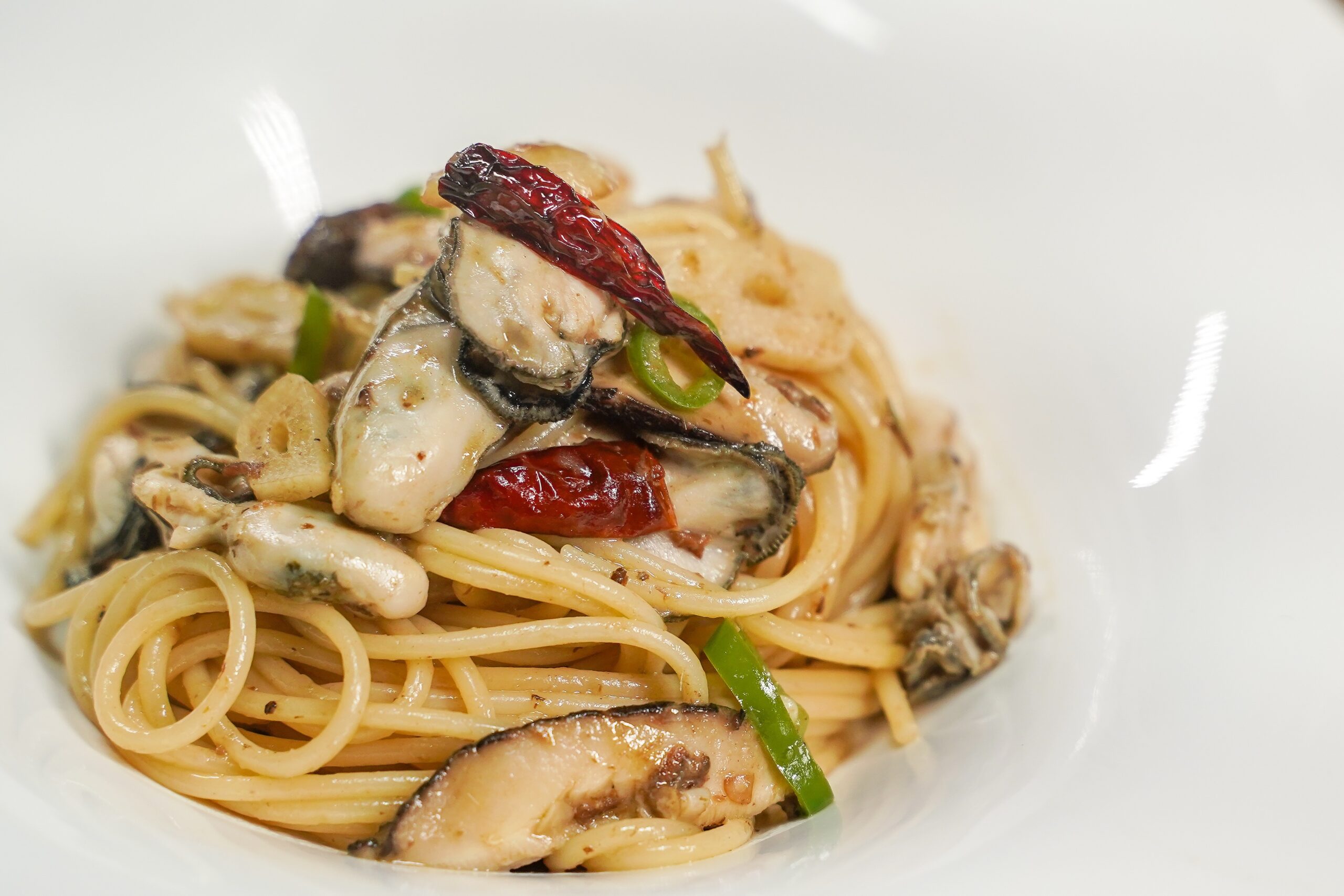 Frische Meeresfrüchte auf Pasta mit Tomatensauce – Zutatenqualität im Restaurant Pasanini in Goch